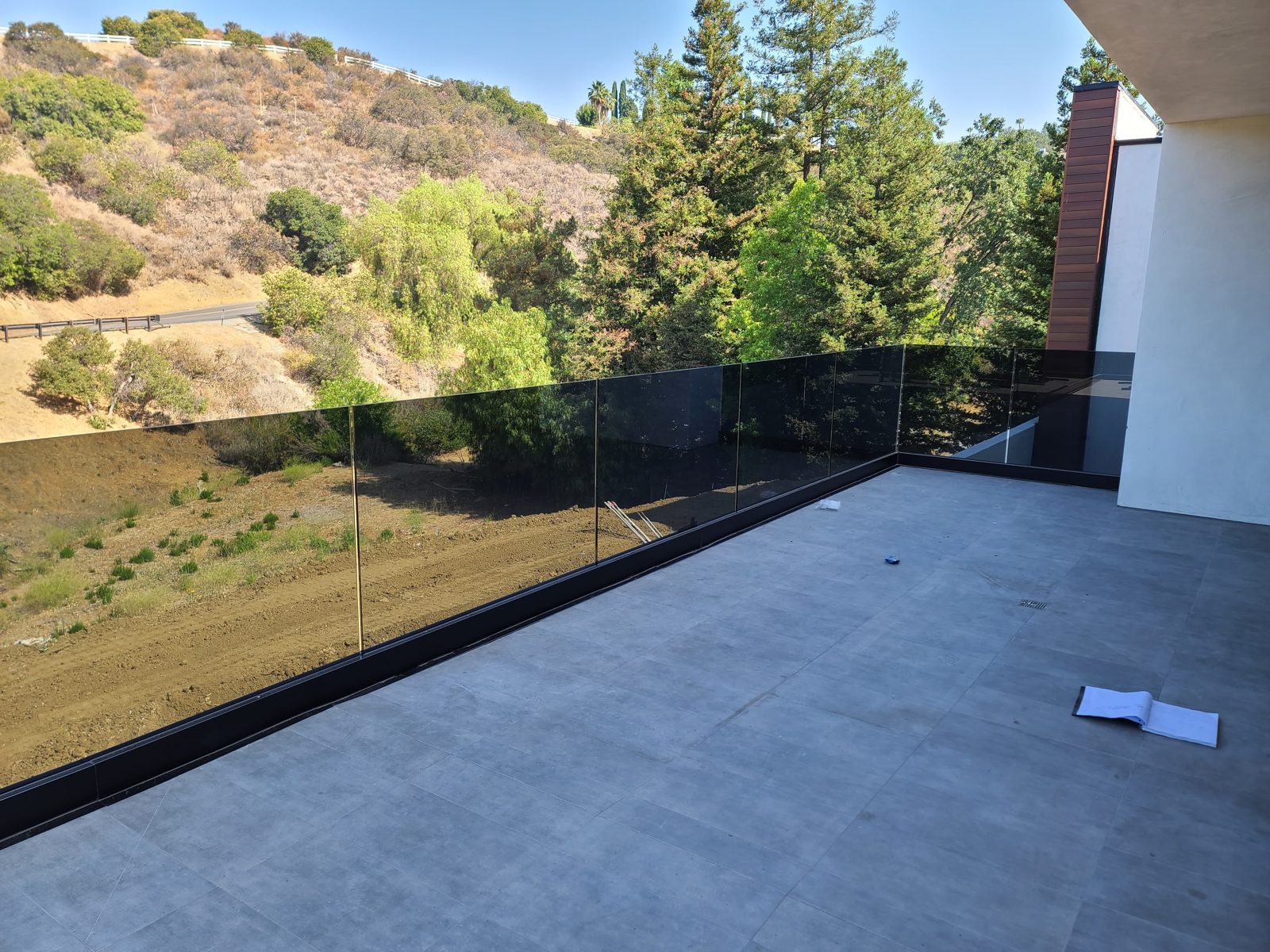 Frameless glass railing balcony under skylights, Phoenix-area home by Mad Touch Glass