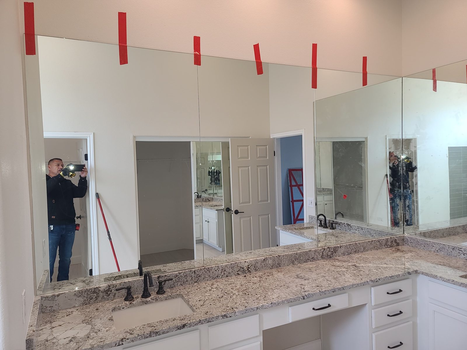 Custom frameless vanity mirror with dual sinks by Mad Touch Glass