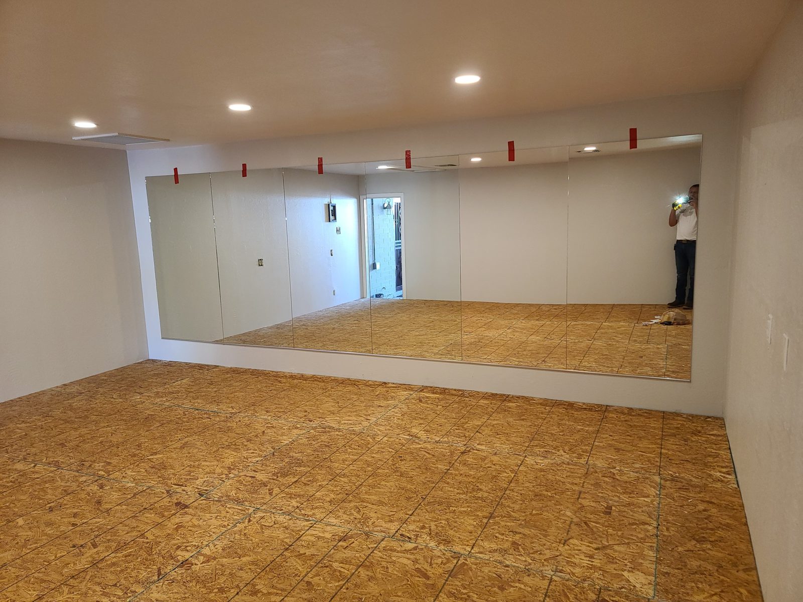 Large frameless wall mirror install by Mad Touch Glass